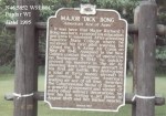 A historical marker on wooden posts, providing information about Major Tom Song in Poynette, Wisconsin.