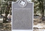 A historical marker in Texas featuring text that summarizes the significance of the site or individual it commemorates, surrounded by trees.